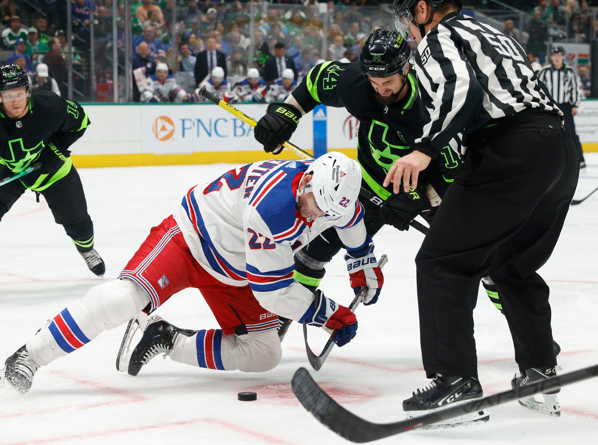 Dallas Stars left wing Jamie Benn (14) fights for a the puck with New York Rangers center...