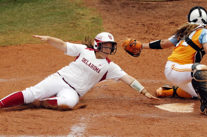 Oklahoma's Brittany Williams misses home plate and a tag by Tennessee's Annie Aldrete but...