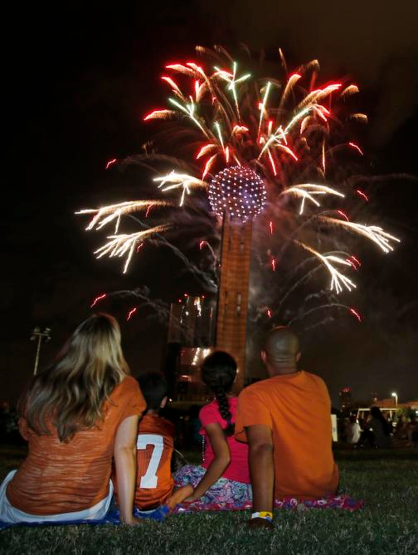 
Amanda, Brodie, Caitlyn and Eric Clemons of Austin sit mesmerized as Reunion Tower puts on...