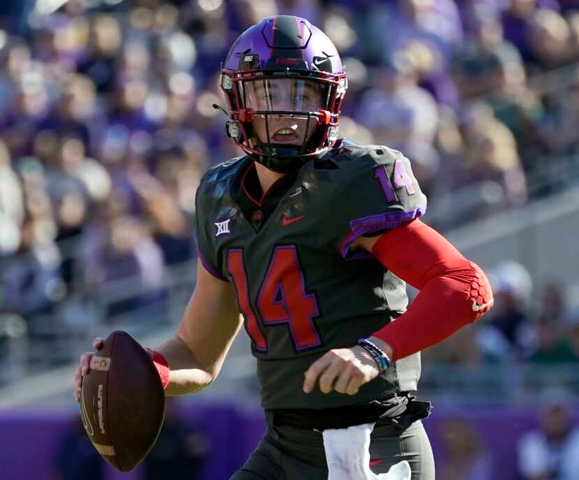 FILE - TCU quarterback Chandler Morris scrambles out of the pocket during an NCAA college...