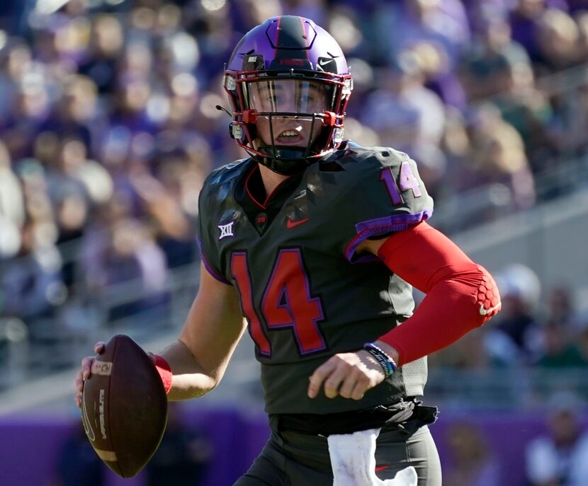 FILE - TCU quarterback Chandler Morris scrambles out of the pocket during an NCAA college...