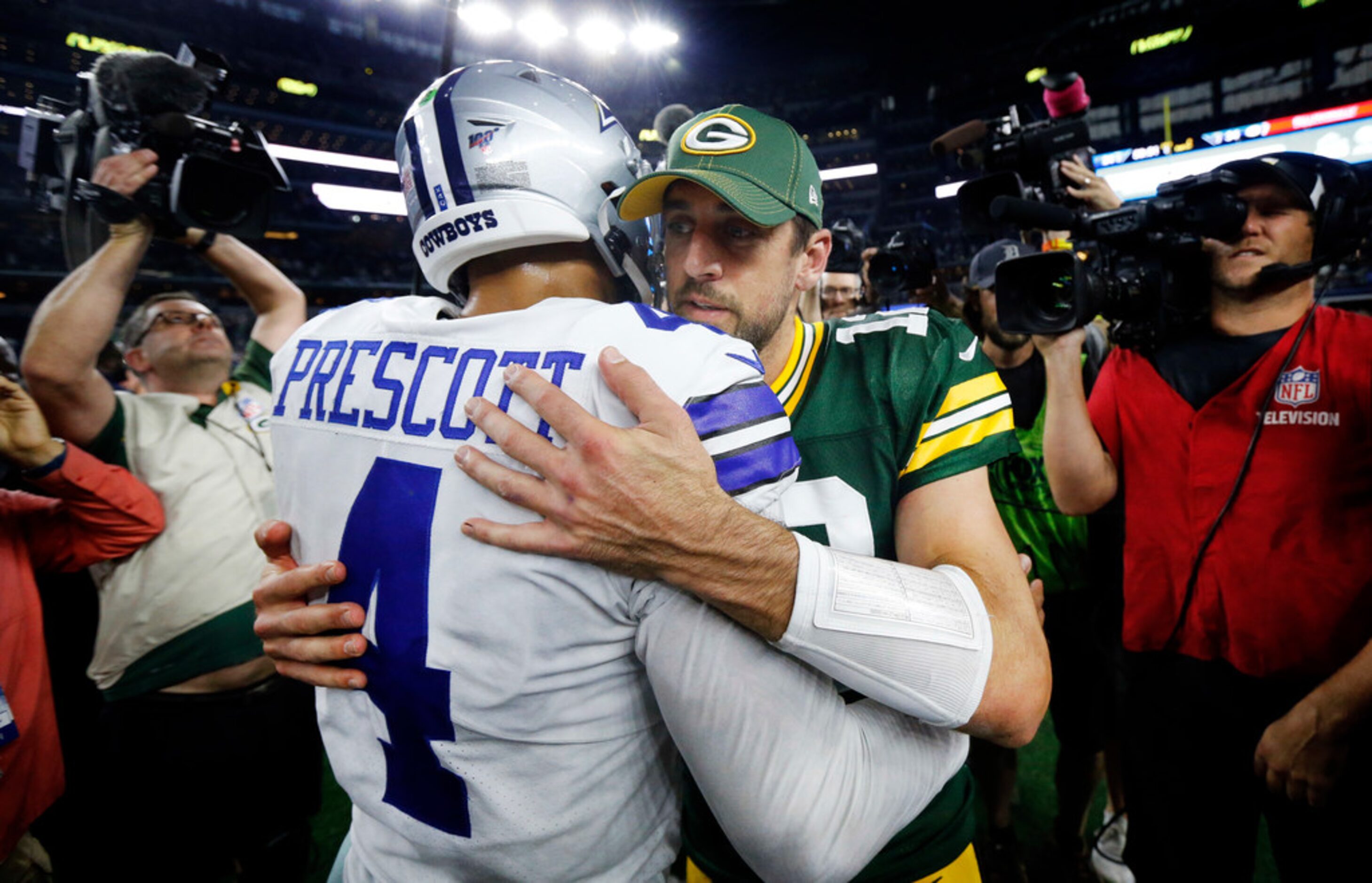 Dallas Cowboys quarterback Dak Prescott (4) congratulates Green Bay Packers quarterback...