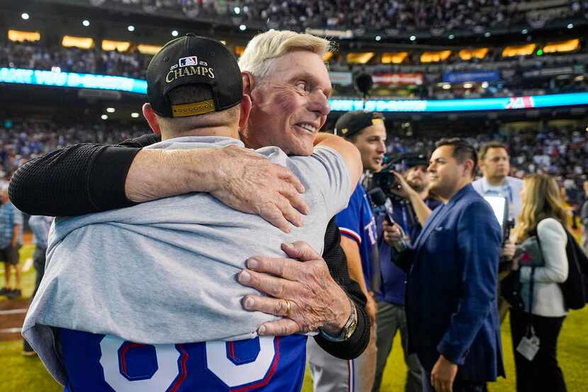 Texas Rangers owner Ray Davis celebrates with players and coaches after a victory over the...