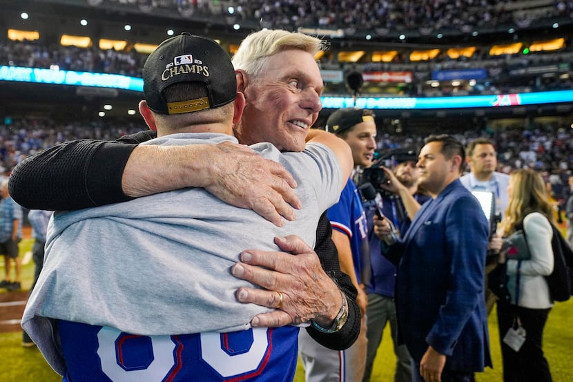 Texas Rangers owner Ray Davis celebrates with players and coaches after a victory over the...