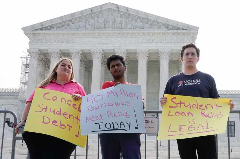 People in favor of canceling student debt protest outside the Supreme Court, Friday, June...
