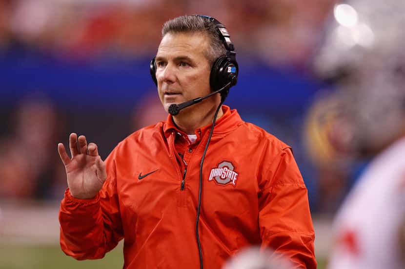 INDIANAPOLIS, IN - DECEMBER 02:  Head coach Urban Meyer of the Ohio State Buckeyes looks on...
