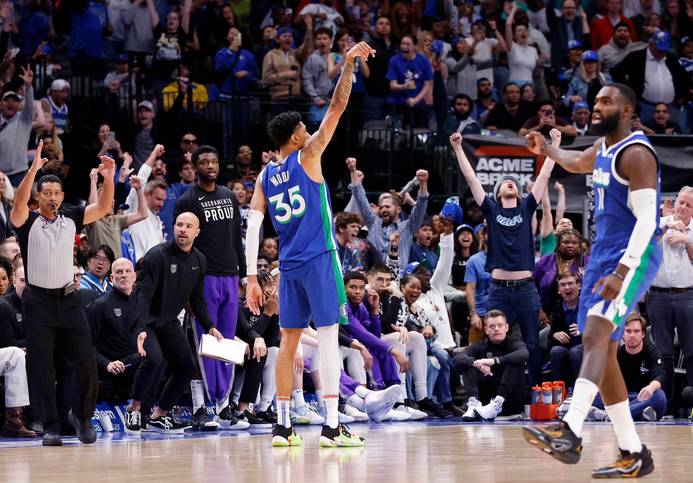 Dallas Mavericks forward Christian Wood (35) holds the pose after he hit a fourth quarter...