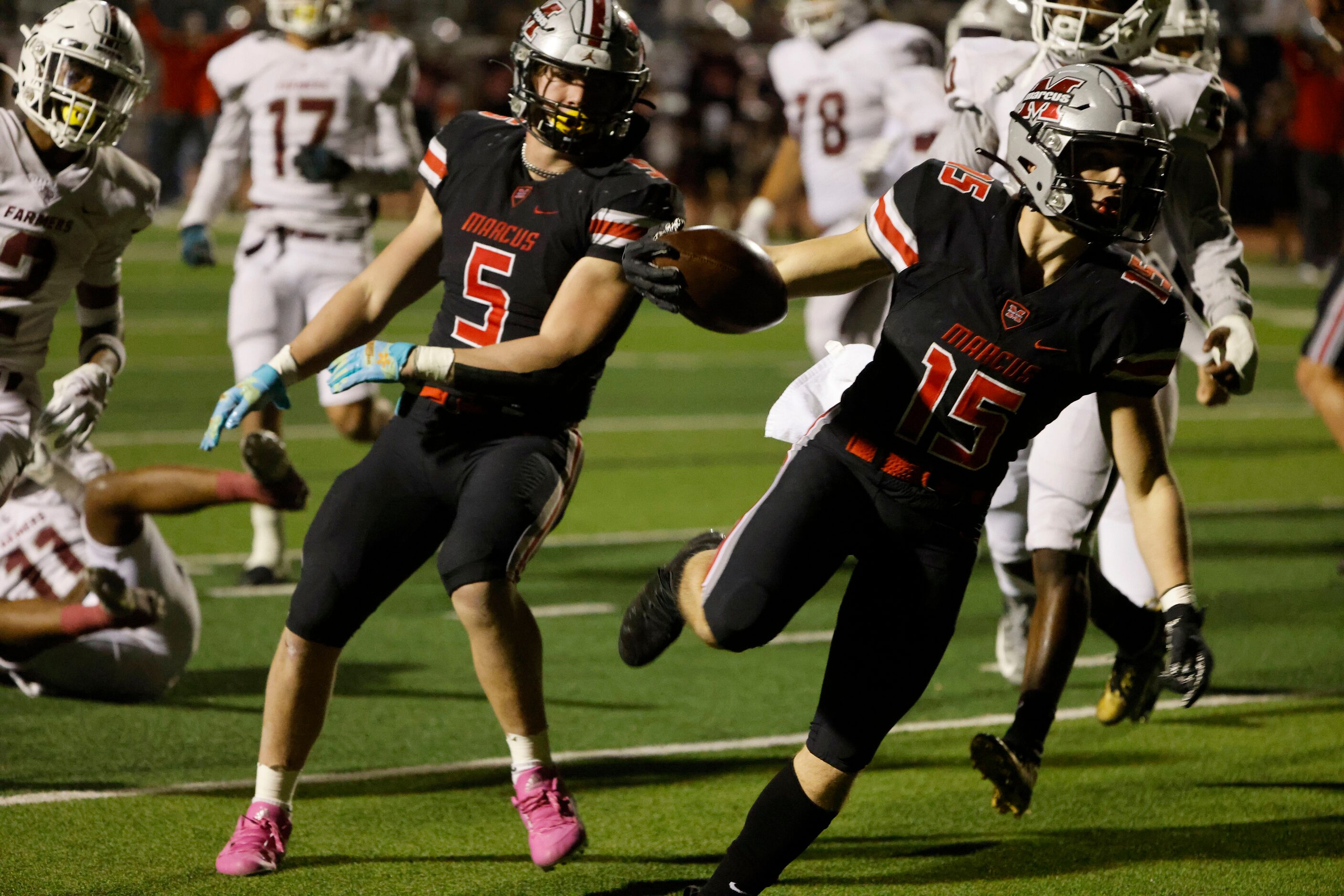 Flower Mound Marcus running back gAb Espinoza (15), scores a touchdown against Lewisville as...