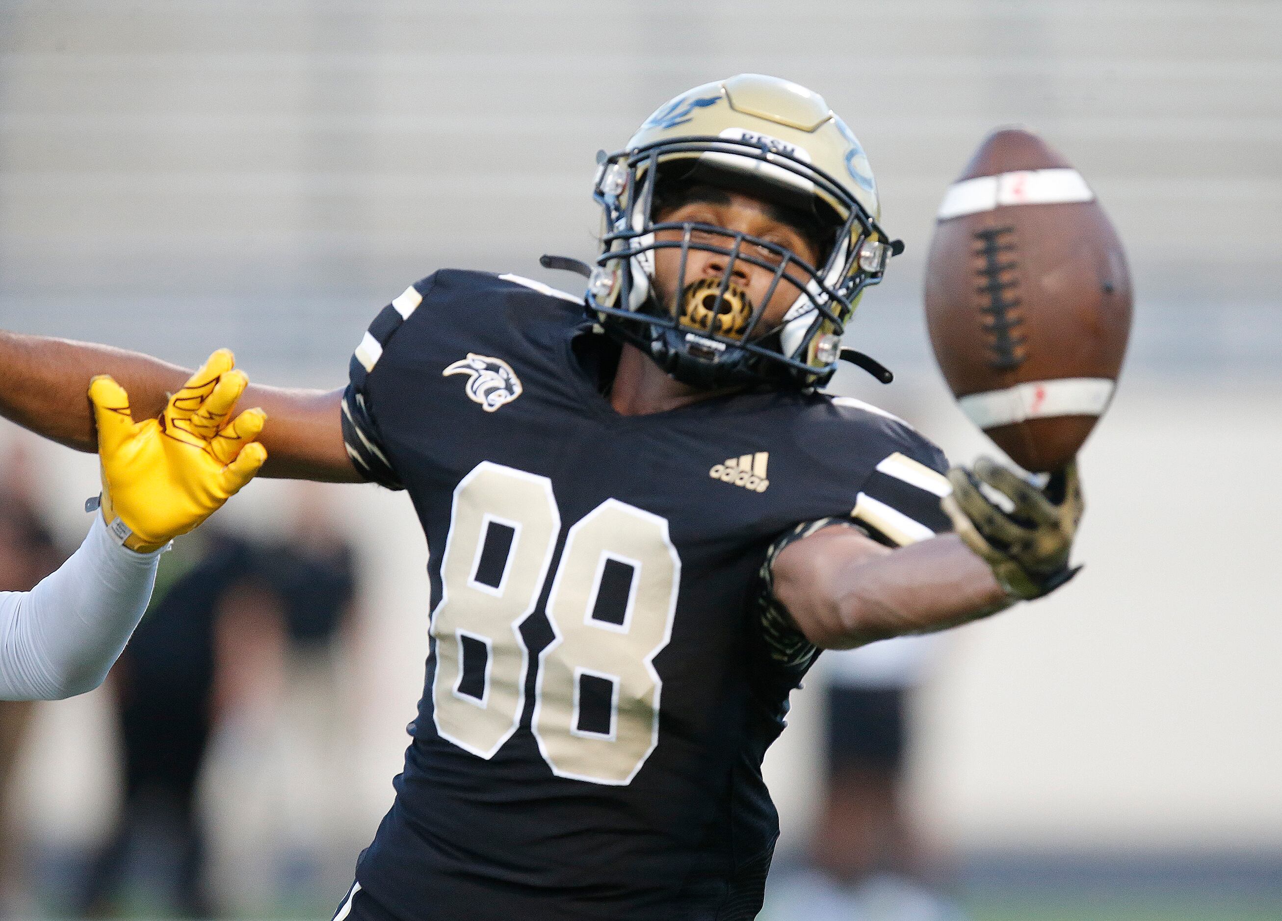 Plano East Senior High School wide receiver Rushil Patel (88) tries but was unable to bring...