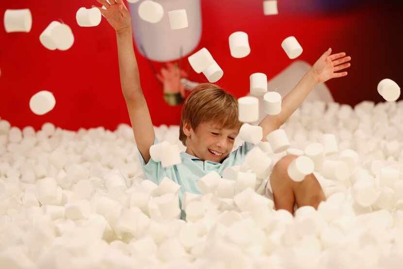 William LeBlanc, 9, plays in the marshmallow pit at Candytopia.