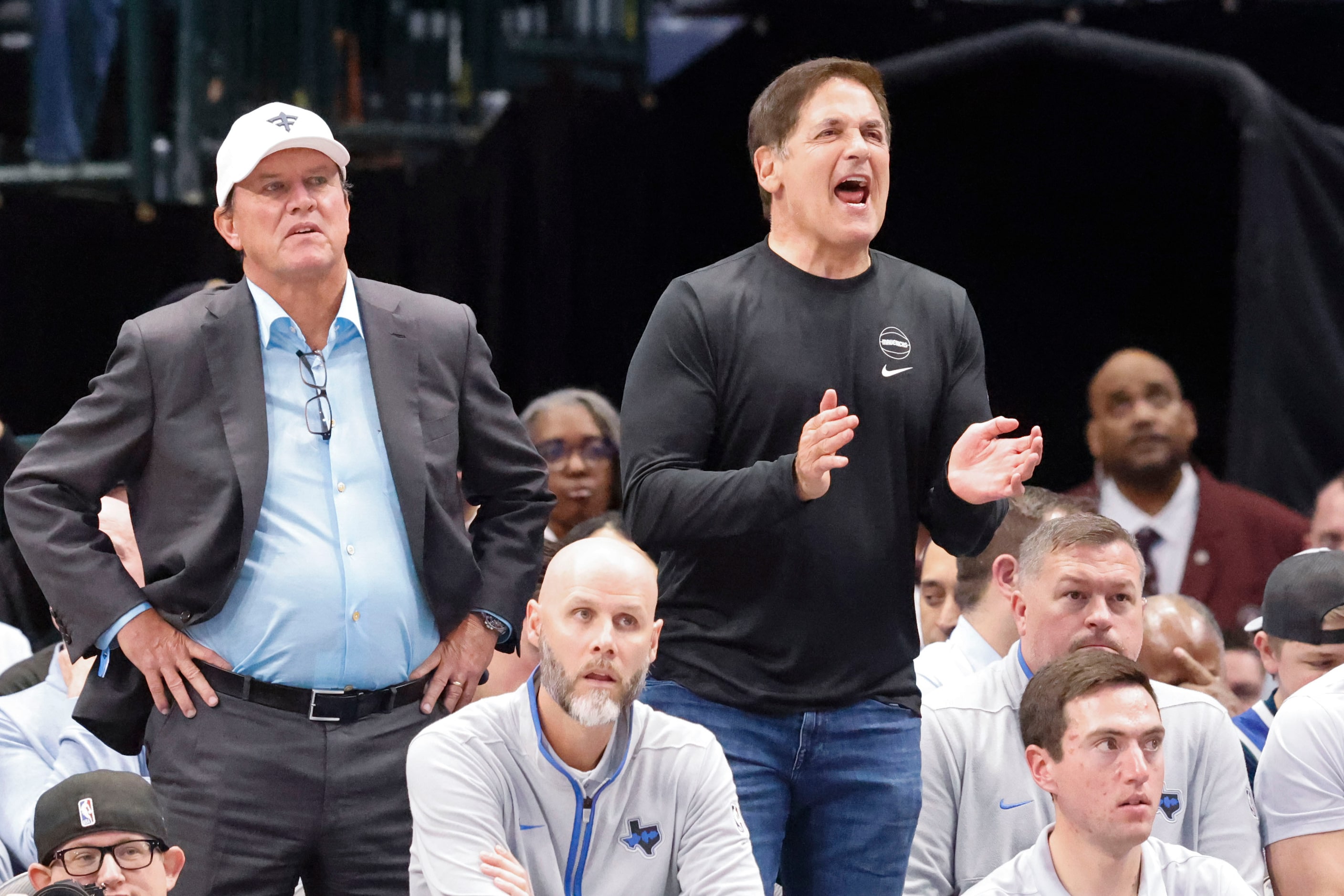 Dallas Mavericks alternate Governor Mark Cuban (right) cheers towards the team during the...