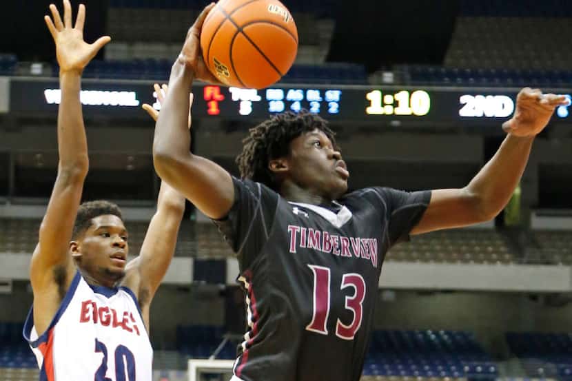 Mansfield Timberview's Isaac Likekele heads to the hoop past Corpus Christi's Makai Brown in...