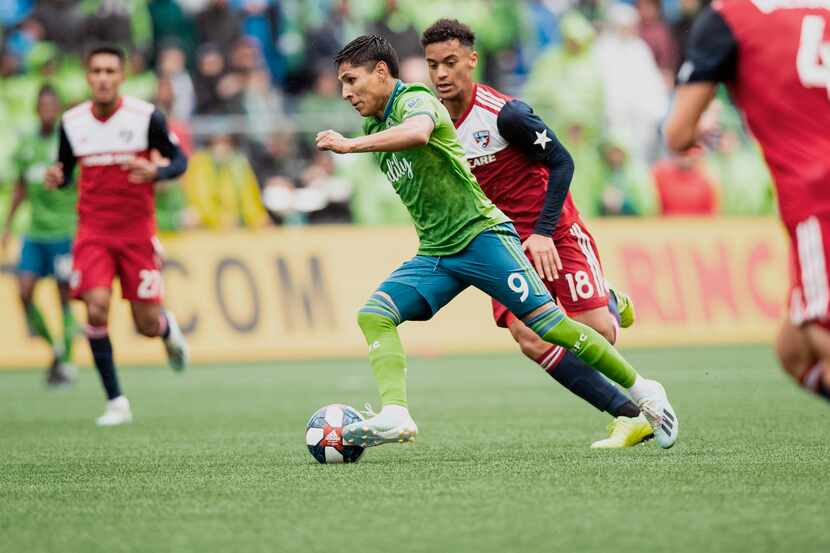 Seattle Sounders forward Raul Ruidiaz (9) moves the ball to score a goal the first half of...