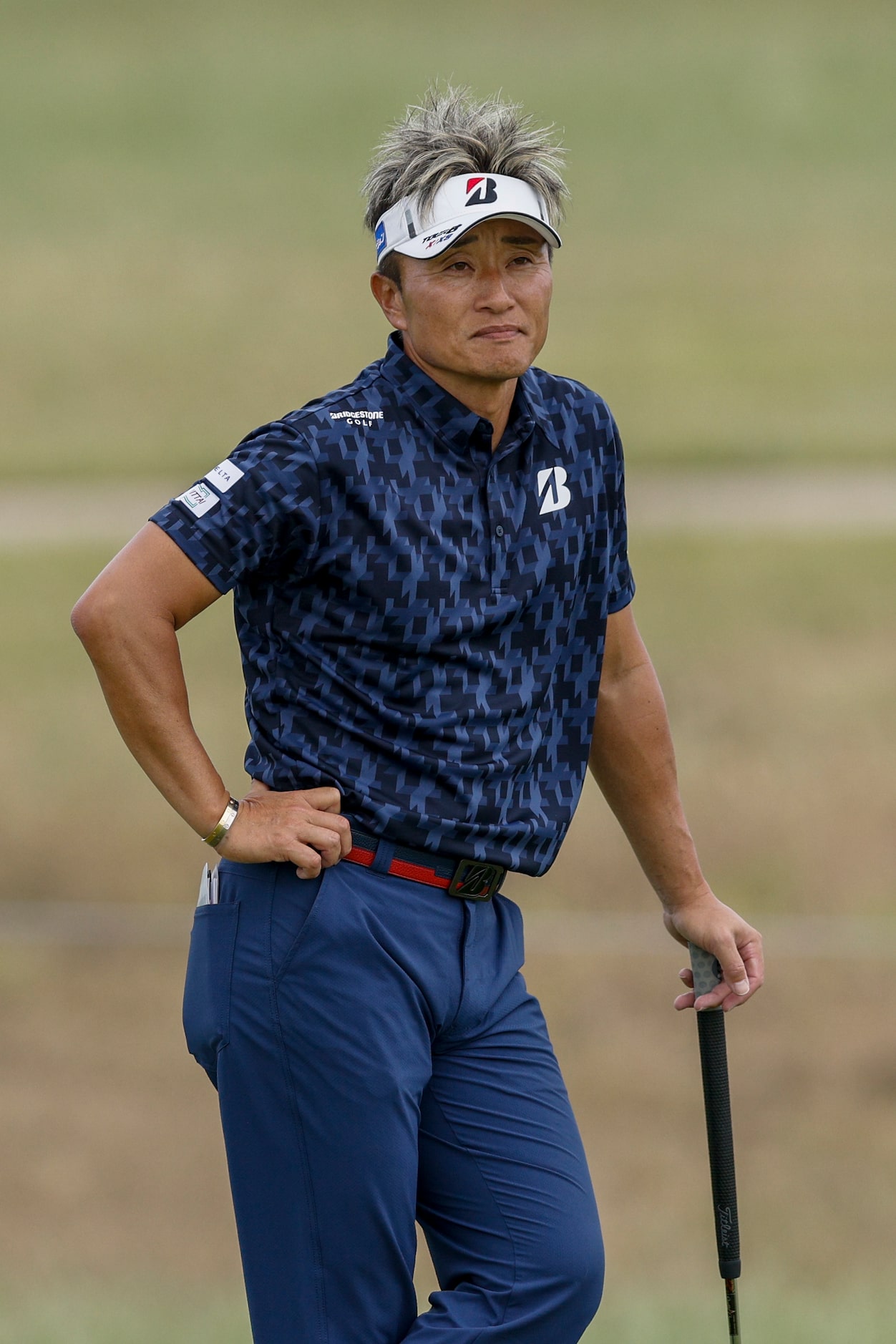 Katsumasa Miyamoto of Japan waits to putt during the first round of the KitchenAid Senior...