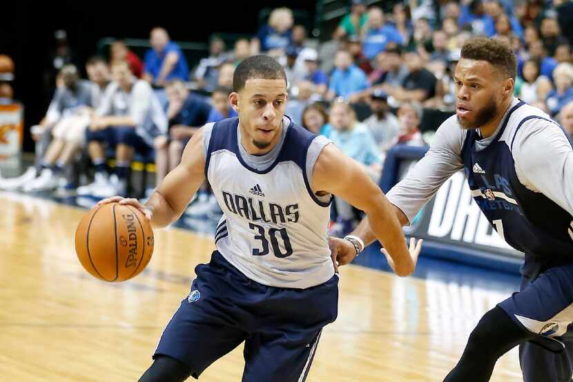 Mavericks guard Seth Curry drives against Justin Anderson during Wednesday's open scrimmage....