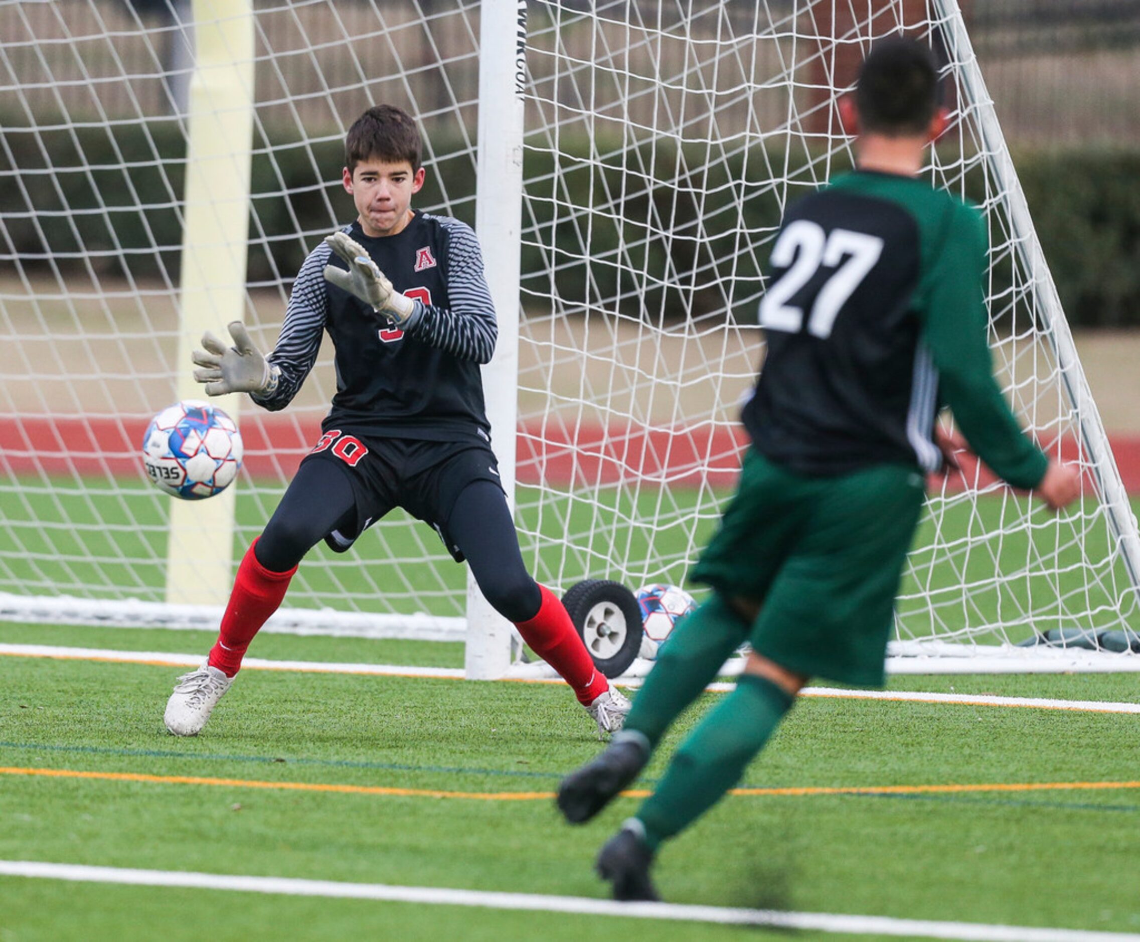 Allen keeper Jackson Leavitt (30) fails to block a shot by Prosper's Gavyn Rosales (27)...