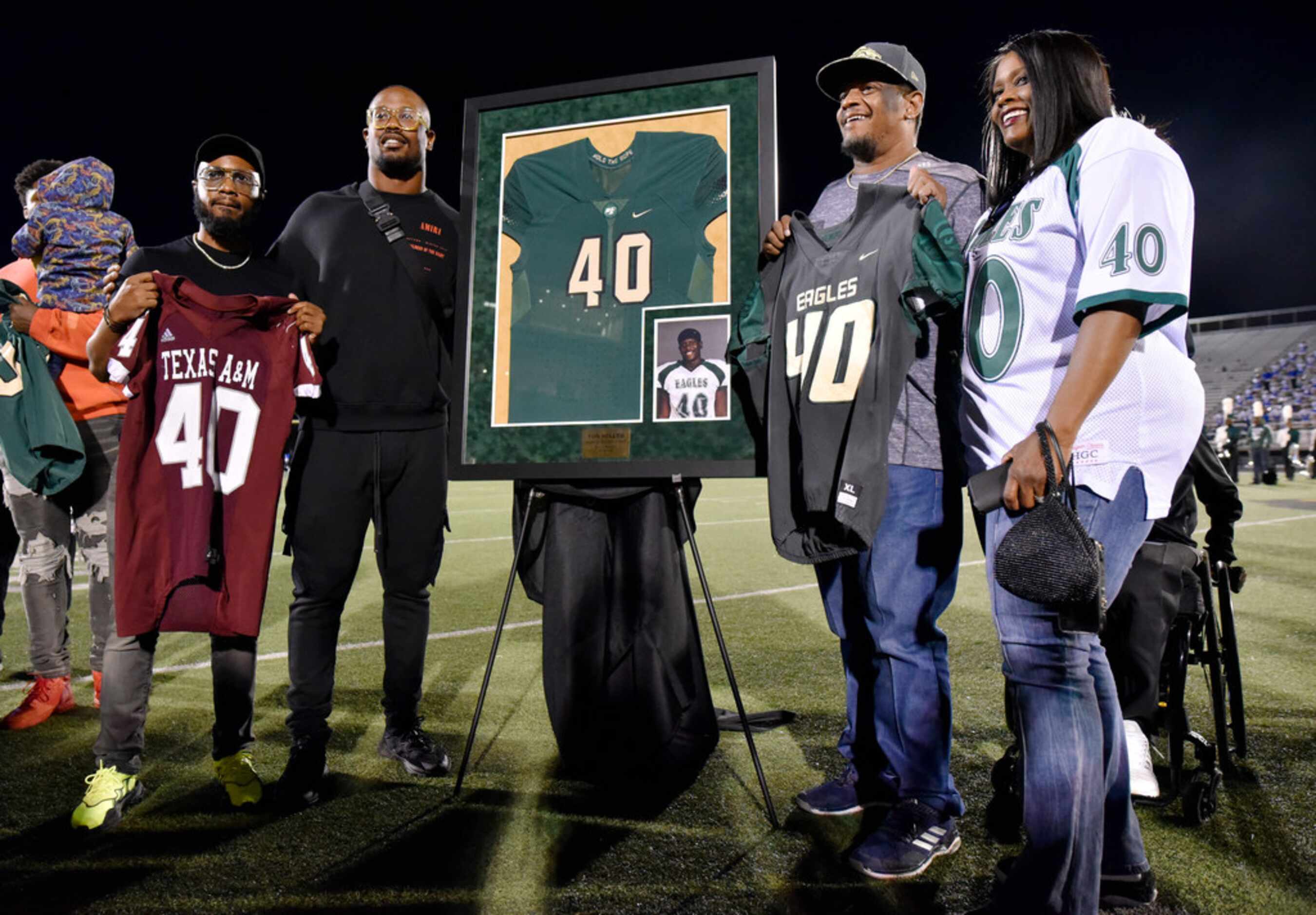 Denver Broncos linebacker and former DeSoto High School player, Von Miller, second from...