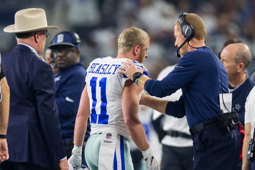 Dallas Cowboys wide receiver Cole Beasley (11) gets a pat on the shoulder from Dallas...