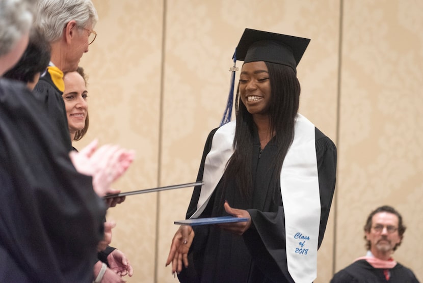 Omotoyosi Ayanwola, center, was one of 10 from the Alcuin School's first graduating class to...