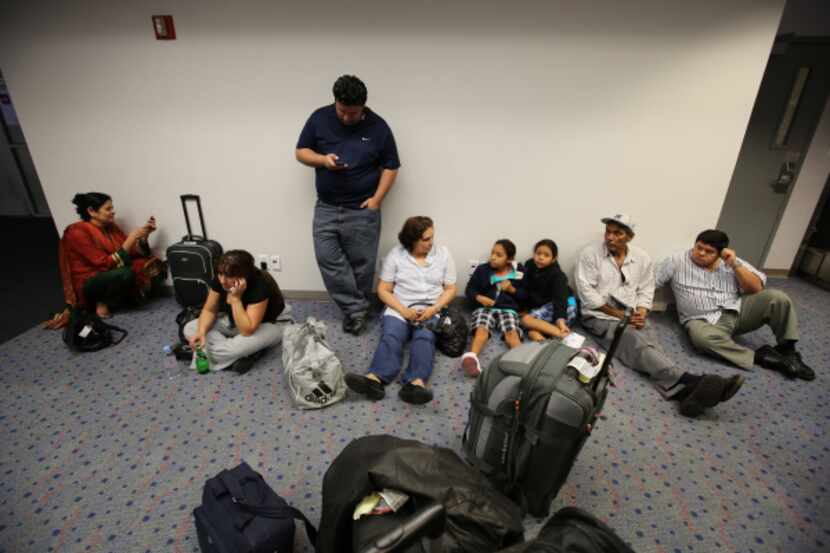 People had long waits at Dallas/Fort Worth International Airport's Terminal E on Tuesday...