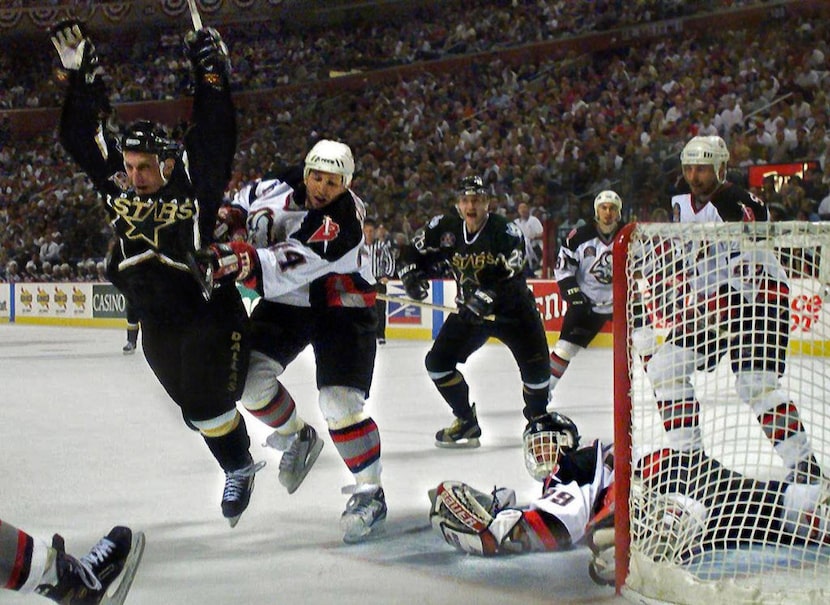 6/19/99 - The Stars' Brett Hull celebrates his winning goal in the third OT of Game 6 of the...