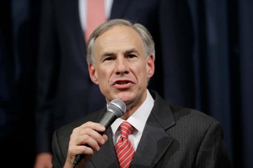  Texas Attorney General Greg Abbott speaks during a news conference with Gov. Rick Perry in...