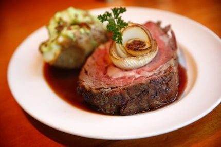 The signature prime rib at Jasper's, served with a loaded baked potato.