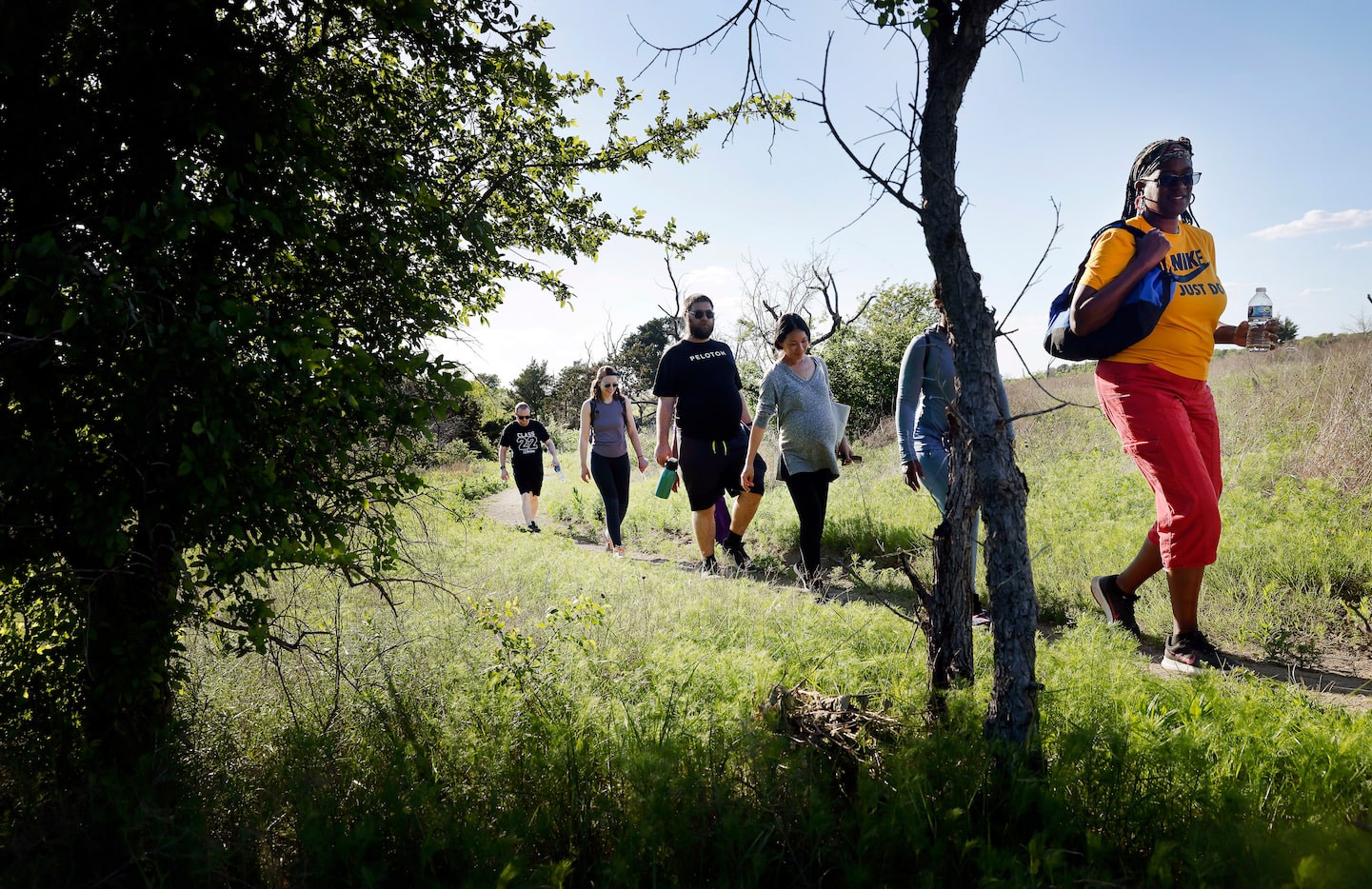 (From left), Staffers from Uplift Education in Dallas finish a team building hike on Talala...