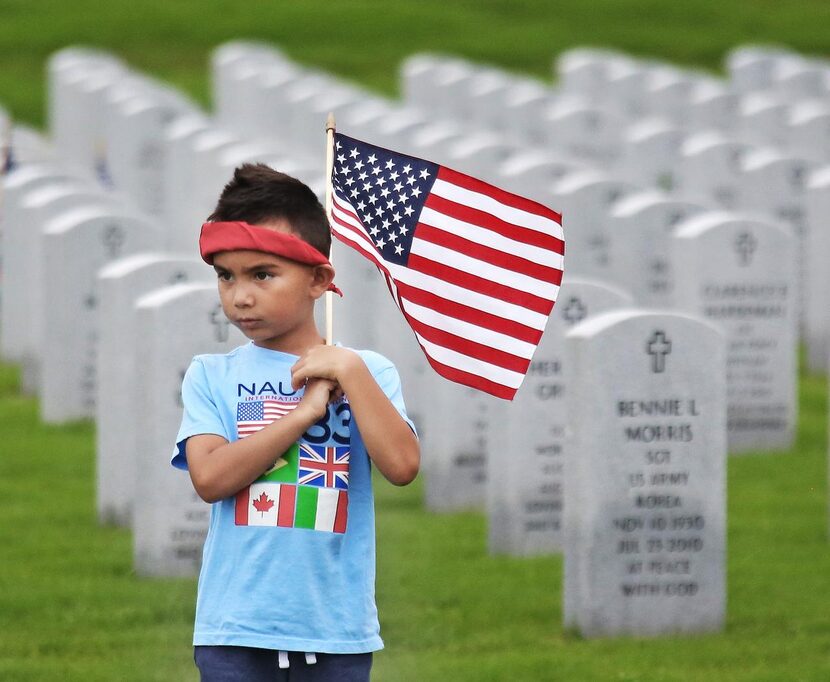 
Five year-old Levi Muncie of Irving took part in Memorial Day activities with his parents...