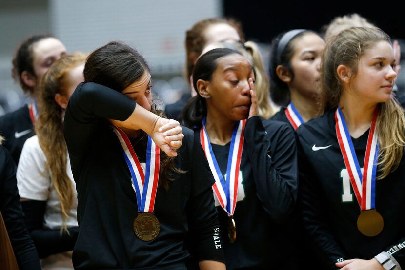 The Lamar Fulshear Chargers celebrate after scoring in the second set of a Class 4A...