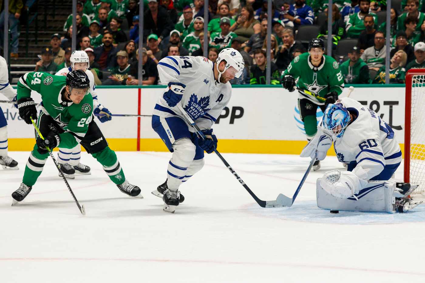 Toronto Maple Leafs goaltender Joseph Woll (60) stops a shot attempt from Dallas Stars...