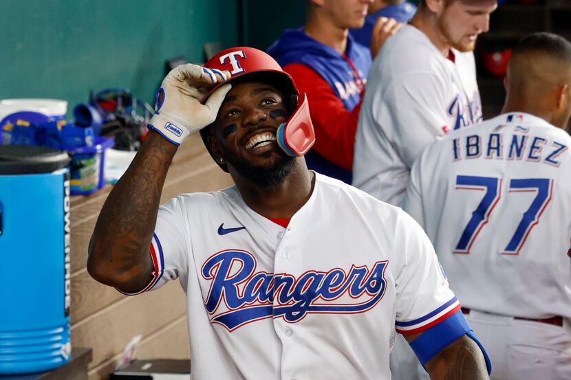 Texas Rangers center fielder Adolis Garcia (53) smiles after recording an RBI during the...