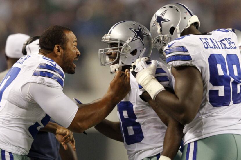 Dallas Cowboys linebacker Orie Lemon (58) is congratulated by Dallas Cowboys defensive end...