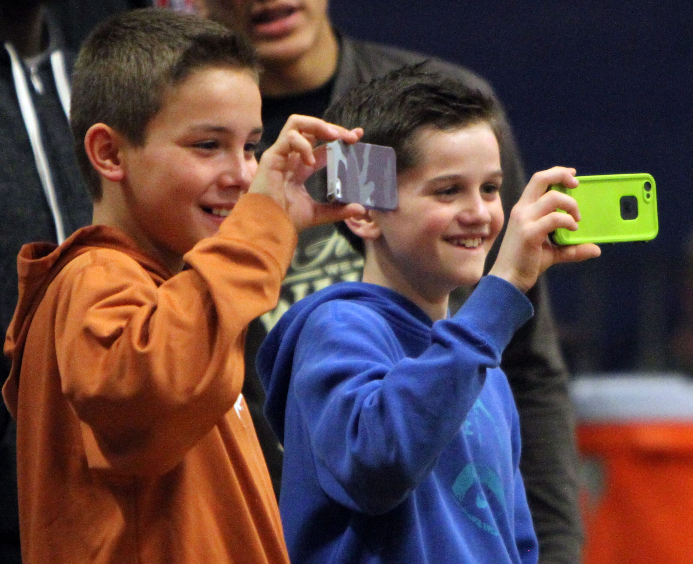 A couple of young Frisco Centennial fans record the second half of the Frisco Centennial...