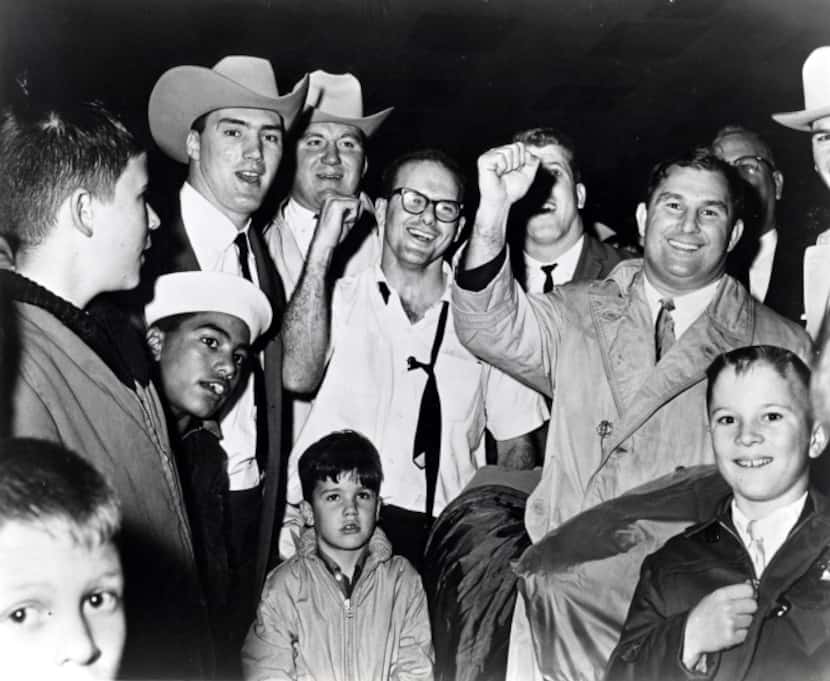 Dallas Texans president Lamar Hunt celebrated with his team after they defeated the Houston...
