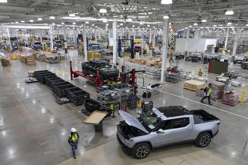 RT1 trucks are assembled and tested on April 14, 2021, before the new Rivian plant fully...