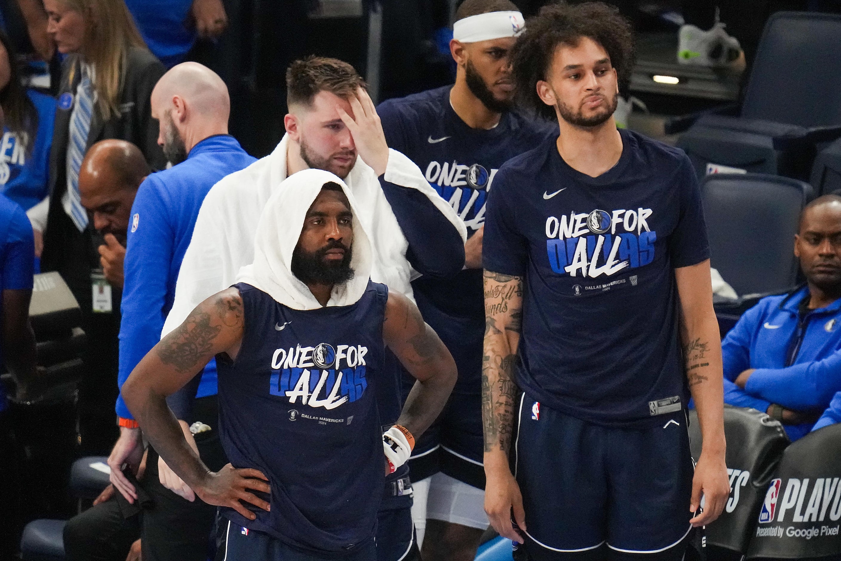 Dallas Mavericks guard Kyrie Irving (from left), guard Luka Doncic, center Daniel Gafford...