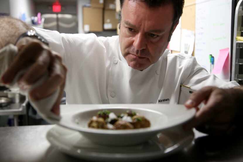 Abraham Salum serves up a dish at Komali in 2015. He sold the Mexican restaurant in 2016.