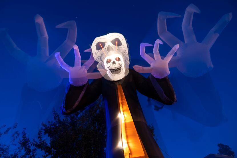 A skeleton inflatable shown with a slow camera shutter, one of many inflatable Halloween...