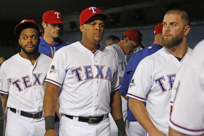 Texas Rangers Delino DeShields (7), Adrian Beltre (29)and Mike Napoli (25), left to right,...