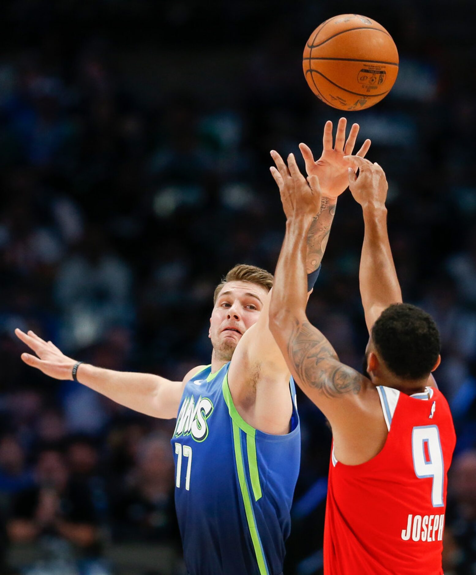 Dallas Mavericks forward Luka Doncic (77) guards Sacramento Kings guard Cory Joseph (9)...