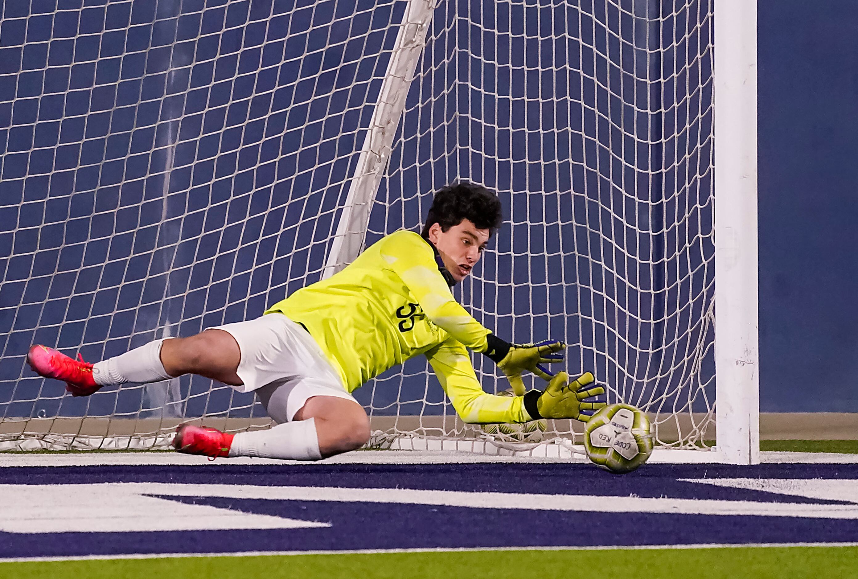Jesuit goalkeeper Cole Hines makes a save on a shot by McKinney Boyd midfielder Casey...