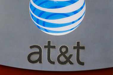 AT&T signage at its corporate headquarters in downtown Dallas. (David Woo/The Dallas Morning...