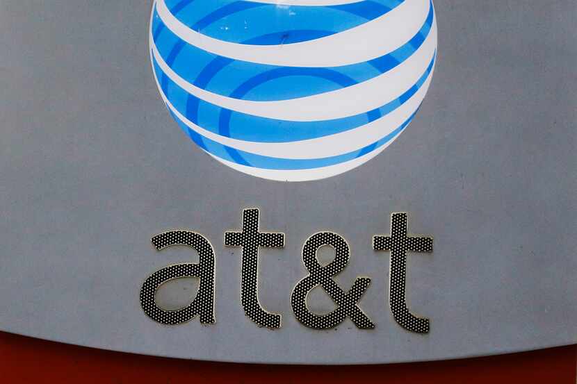AT&T signage at its corporate headquarters in downtown Dallas. (David Woo/The Dallas Morning...