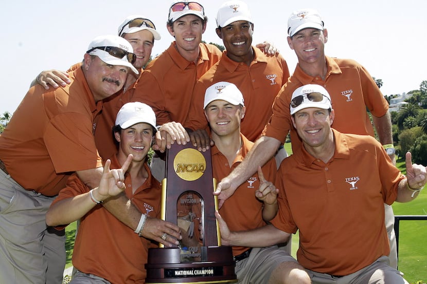 In this file photo, the University of Texas men's golf team celebrates their victory in the...