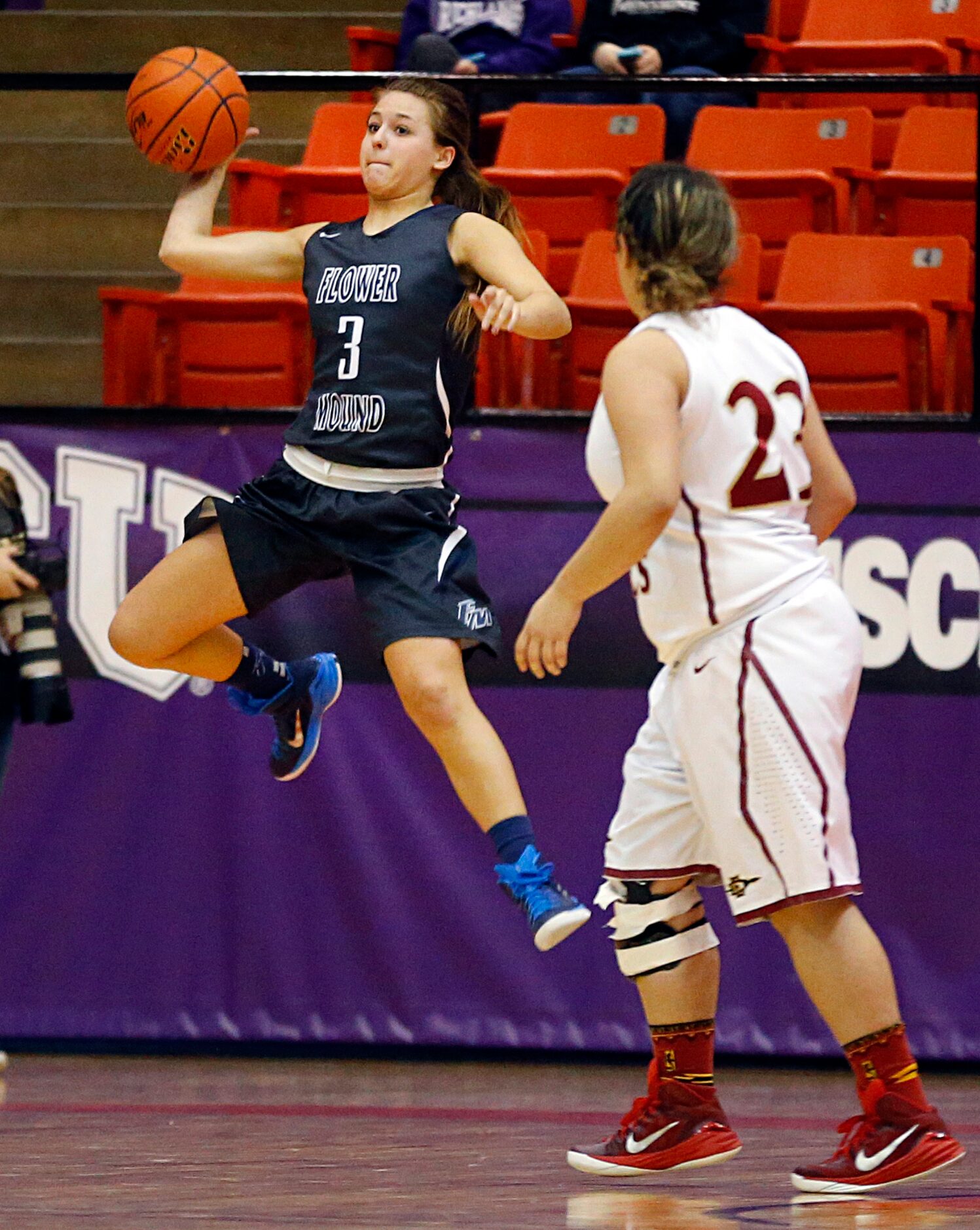 Flower Mound guard Kenzie Grill (3) tries to save a loose ball from going out of bounds...