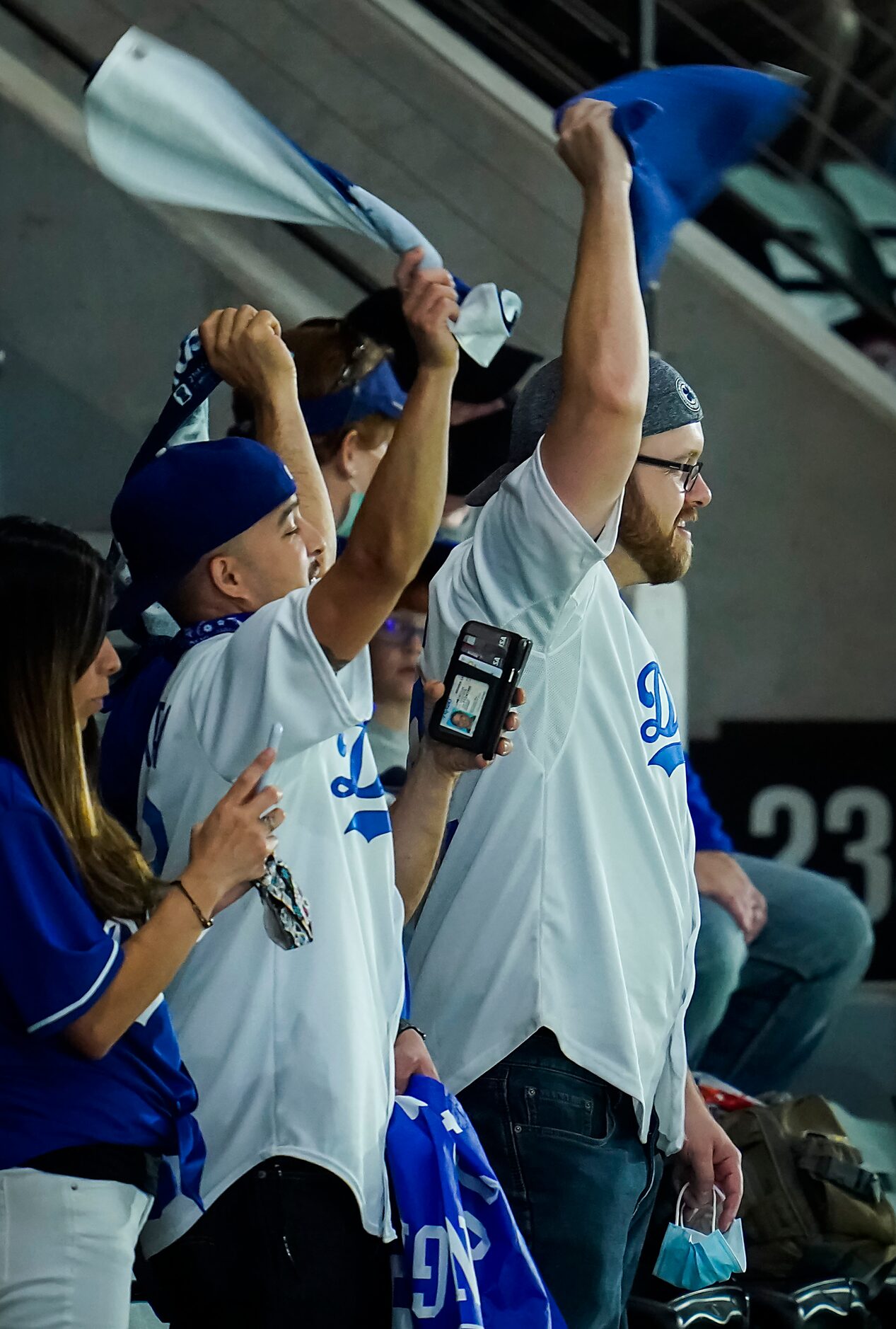 Los Angeles Dodgers fans cheer their team during the ninth inning against the Tampa Bay Rays...