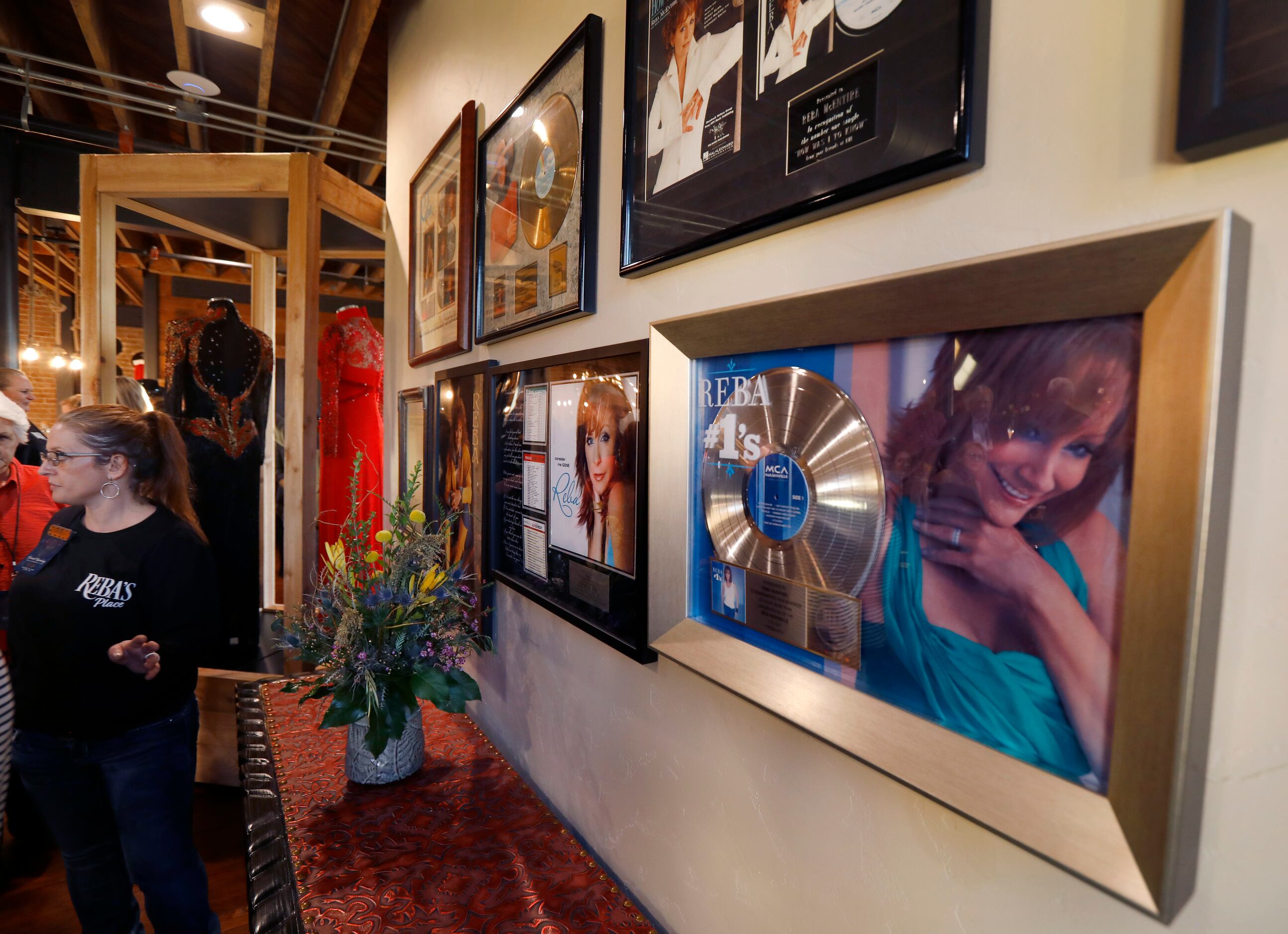 Gold records line the wall of country music legend Reba McEntire’s new restaurant, Reba’s...