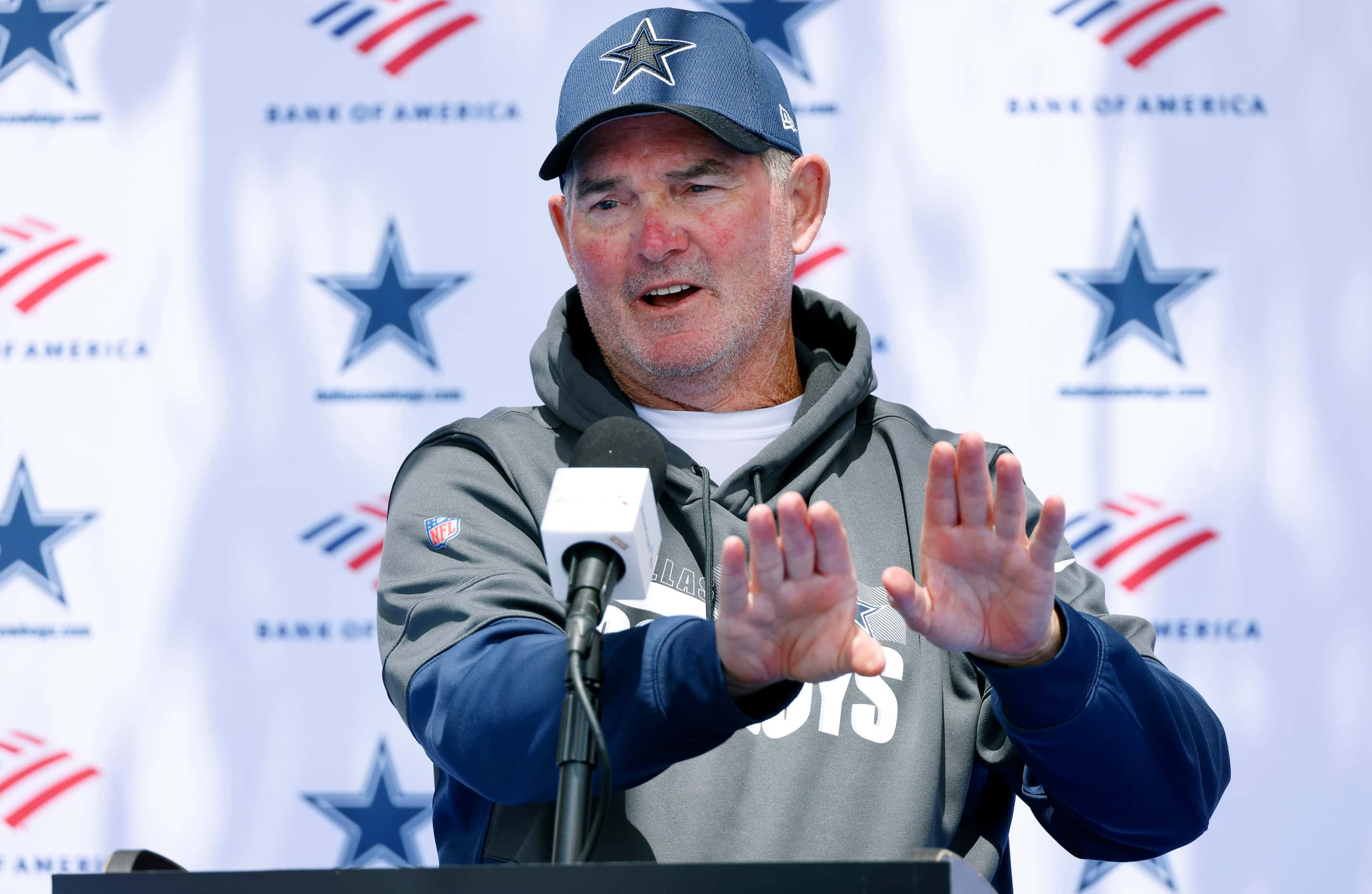 Dallas Cowboys defensive coordinator Mike Zimmer answers questions from the media following...