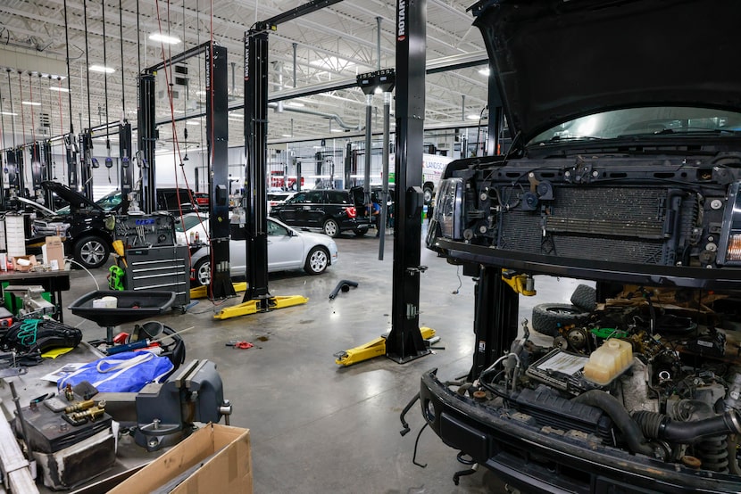 A Ford pickup sits in a service bay at Platinum Ford in Terrell.